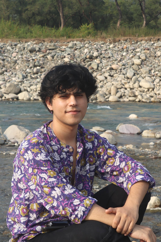 Aditya by a river