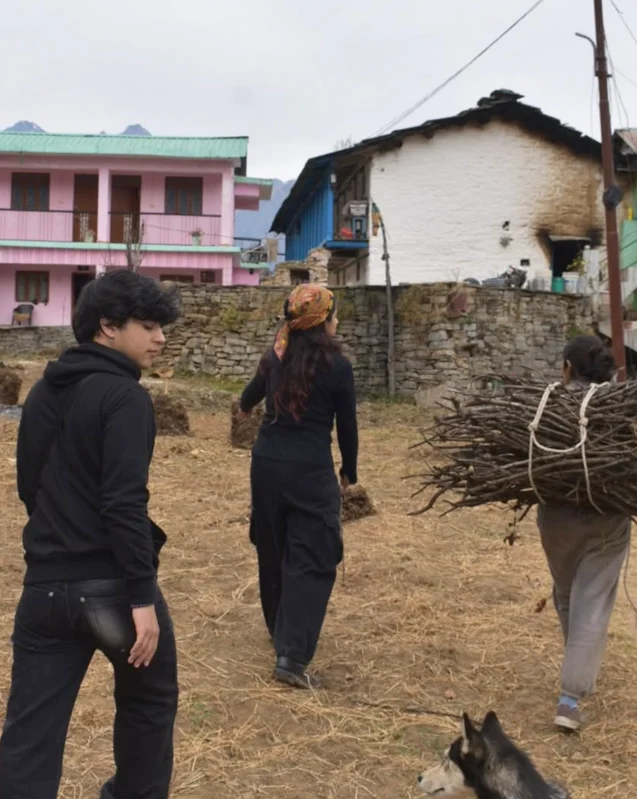 Aditya walking through a village setting